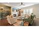 Cozy living room features a fireplace, hardwood floors, and comfortable seating with an open plan at 1598 Aldworth Se Pl, Marietta, GA 30339