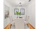 Cozy dining room with a glass-top table, comfortable seating, and bright natural light at 1895 Flat Shoals Se Rd, Atlanta, GA 30316