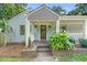 Inviting front porch showcasing the home's entrance and Craftsman details at 1895 Flat Shoals Se Rd, Atlanta, GA 30316