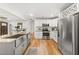 Modern kitchen with stainless steel appliances, white cabinetry, and a stylish island at 1895 Flat Shoals Se Rd, Atlanta, GA 30316