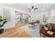 Open-concept living room featuring hardwood floors and seamless flow into the kitchen at 1895 Flat Shoals Se Rd, Atlanta, GA 30316