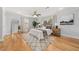 Sunlit main bedroom boasts wood floors, a ceiling fan, a large window, and neutral decor at 1895 Flat Shoals Se Rd, Atlanta, GA 30316