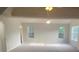 Large bedroom with carpet and windows with treed views at 2504 Hannah Haven Dr, Conyers, GA 30012