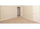 Bedroom with carpet, double door closet, and view into hallway at 2504 Hannah Haven Dr, Conyers, GA 30012