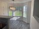 Bright breakfast nook with bay window features modern chandelier, light-colored floors, and neutral paint at 2504 Hannah Haven Dr, Conyers, GA 30012