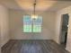 Elegant dining room featuring wainscoting and contemporary chandelier at 2504 Hannah Haven Dr, Conyers, GA 30012