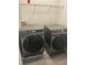 Convenient laundry room featuring side-by-side, front-load Samsung washer and dryer at 2504 Hannah Haven Dr, Conyers, GA 30012