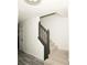 Carpeted staircase with stained railing at 2504 Hannah Haven Dr, Conyers, GA 30012