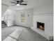 Living room features gray carpet, a brick fireplace, and a ceiling fan at 3840 Natalie Way, Ellenwood, GA 30294