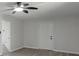 Living room features grey walls, wood-look flooring, and ceiling fan at 3840 Natalie Way, Ellenwood, GA 30294