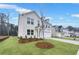 Two-story brick home with a two-car garage and newly installed lawn at 6096 Marigold Way, Atlanta, GA 30349