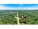 Aerial view of the homesite location with a house-shaped marker pinned along a busy road at 8587 Cumming Se Hwy, Canton, GA 30115