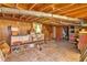 Unfinished basement with wood beam ceiling and concrete floor at 8587 Cumming Se Hwy, Canton, GA 30115
