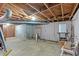 An unfinished basement showing exposed ductwork, a concrete floor, and cinder block wall at 8587 Cumming Se Hwy, Canton, GA 30115