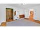 Bedroom featuring hardwood floors, natural lighting, and an adjacent closet at 8587 Cumming Se Hwy, Canton, GA 30115