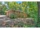 Brick exterior with shrubbery and a wooded lot at 8587 Cumming Se Hwy, Canton, GA 30115