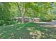 Traditional home on lush lot with mature trees at 8587 Cumming Se Hwy, Canton, GA 30115