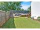 Well-manicured backyard with wooden fence and lawn at 1331 Red Hill Rd, Marietta, GA 30008