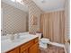 Cozy bathroom featuring a shower-tub combo and a vanity at 1331 Red Hill Rd, Marietta, GA 30008