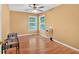 A bright bedroom with windows for ample natural light and hardwood floors at 1331 Red Hill Rd, Marietta, GA 30008