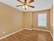 Bedroom with a ceiling fan, light-colored walls, and hardwood flooring at 1331 Red Hill Rd, Marietta, GA 30008