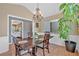 Elegant dining room featuring hardwood floors, decorative chandelier, and neutral paint tones at 1331 Red Hill Rd, Marietta, GA 30008