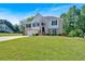 Inviting two-story home featuring a manicured lawn, brick facade, and attached two-car garage at 1331 Red Hill Rd, Marietta, GA 30008