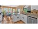 Open kitchen area featuring stainless steel appliances, a breakfast bar, and a view into the dining area at 1331 Red Hill Rd, Marietta, GA 30008