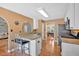 Well-equipped kitchen area with a breakfast bar and an open view into the dining and living areas at 1331 Red Hill Rd, Marietta, GA 30008