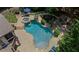 Aerial view of a backyard pool, spa, and outdoor seating area at 3560 Greenside Ct, Dacula, GA 30019