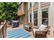 Relaxing back deck with comfortable seating and grill, perfect for outdoor entertaining overlooking the landscape at 3560 Greenside Ct, Dacula, GA 30019