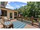 Spacious back deck offers comfortable seating and overlooks the serene pool and lush greenery at 3560 Greenside Ct, Dacula, GA 30019