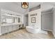 Stylish bathroom featuring a freestanding tub, double vanity, and modern fixtures, creating a luxurious and relaxing retreat at 3560 Greenside Ct, Dacula, GA 30019