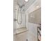 This bathroom features white tiling, mosaic floors, and a tiled wall accent over the shower at 3560 Greenside Ct, Dacula, GA 30019