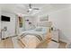 This light and airy main bedroom features a tray ceiling and soft, neutral decor at 3560 Greenside Ct, Dacula, GA 30019
