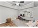 A bonus room with wood-look flooring and a wall mirror reflecting a bedroom at 3560 Greenside Ct, Dacula, GA 30019