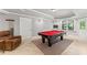 A game room with a pool table and a cozy seating area at 3560 Greenside Ct, Dacula, GA 30019