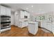 Bright kitchen featuring white cabinets, marble countertops and stainless steel appliances at 3560 Greenside Ct, Dacula, GA 30019