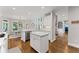 Spacious kitchen with white island, stainless steel appliances, and hardwood floors at 3560 Greenside Ct, Dacula, GA 30019