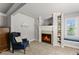 Comfortable living room with fireplace, custom built-ins, and a cozy window seat, great for reading or relaxing at 3560 Greenside Ct, Dacula, GA 30019