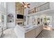 Open-concept living area with stone fireplace, built-in shelving and balcony overlooking the main level at 3560 Greenside Ct, Dacula, GA 30019