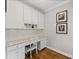 Home office space with built-in shelving, drawers and plenty of natural light at 3560 Greenside Ct, Dacula, GA 30019