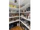 Well-organized walk-in pantry featuring sturdy shelving that provides ample storage for food and kitchen essentials at 3560 Greenside Ct, Dacula, GA 30019