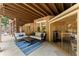Inviting covered patio with comfortable seating and an adjacent sauna at 3560 Greenside Ct, Dacula, GA 30019