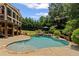 Inviting pool area with a rock waterfall, surrounded by lush landscaping, perfect for relaxation and enjoyment at 3560 Greenside Ct, Dacula, GA 30019
