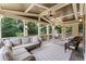 Relaxing screened porch with comfortable seating and a ceiling fan at 3560 Greenside Ct, Dacula, GA 30019