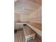 Modern sauna with wooden benches and recessed lighting at 3560 Greenside Ct, Dacula, GA 30019