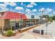 Street view of commercial buildings with vibrant facades and pedestrian-friendly walkways for easy access to local businesses at 55 Forest Rd, Stockbridge, GA 30281