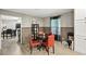 Cozy dining room with seating for four and an open view into another room at 55 Forest Rd, Stockbridge, GA 30281