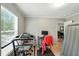 Bright exercise room featuring a treadmill, desk, and natural light from large window at 55 Forest Rd, Stockbridge, GA 30281